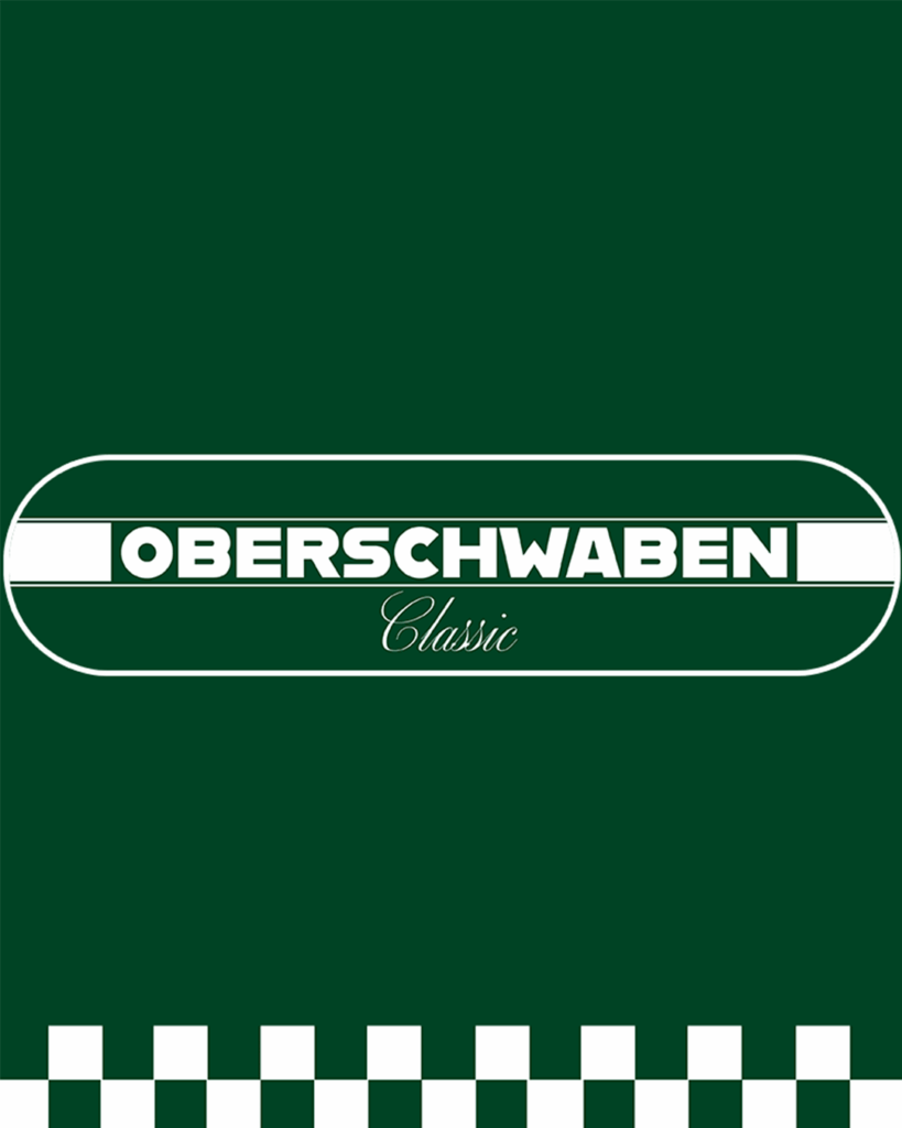 Logo der Oberschwaben Classic: Weißer Schriftzug ‚OBERSCHWABEN Classic‘ auf grünem Hintergrund, umrahmt von einem weißen ovalen Rahmen mit einem weißen Querstreifen in der Mitte und einer weißen Karomusterleiste am unteren Rand.